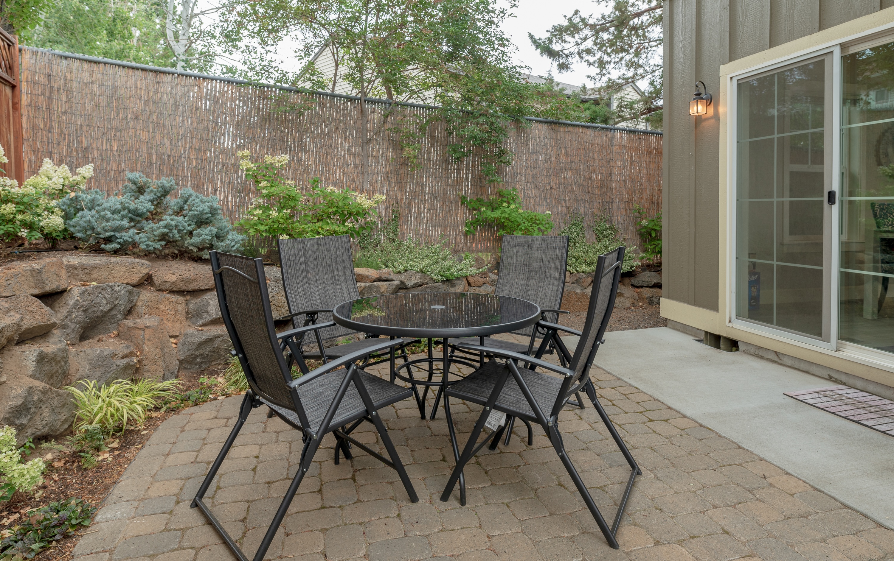 Outdoor dining area on the patio with seating for 4.