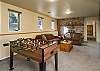 Bottom floor game room with Pool table and Foosball table