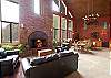 Cascade Village Lodge main lounge area with seating and fireplace.