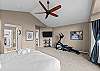 Primary bedroom, king bed, TV, mini-split, elliptical, hand weights