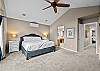 Primary bedroom, king bed, TV, mini-split, elliptical, hand weights