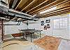 Pingpong table in unfinished basement