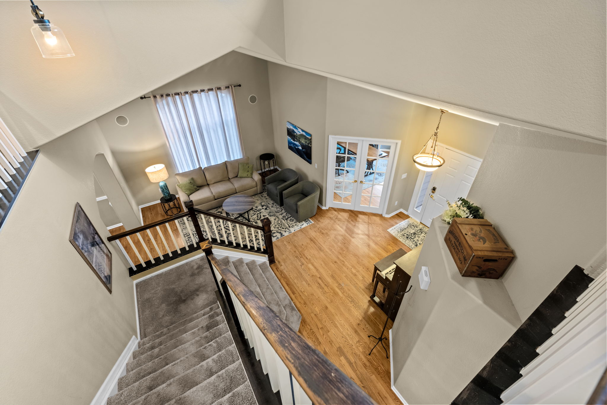 View of entry and formal living space from upstairs