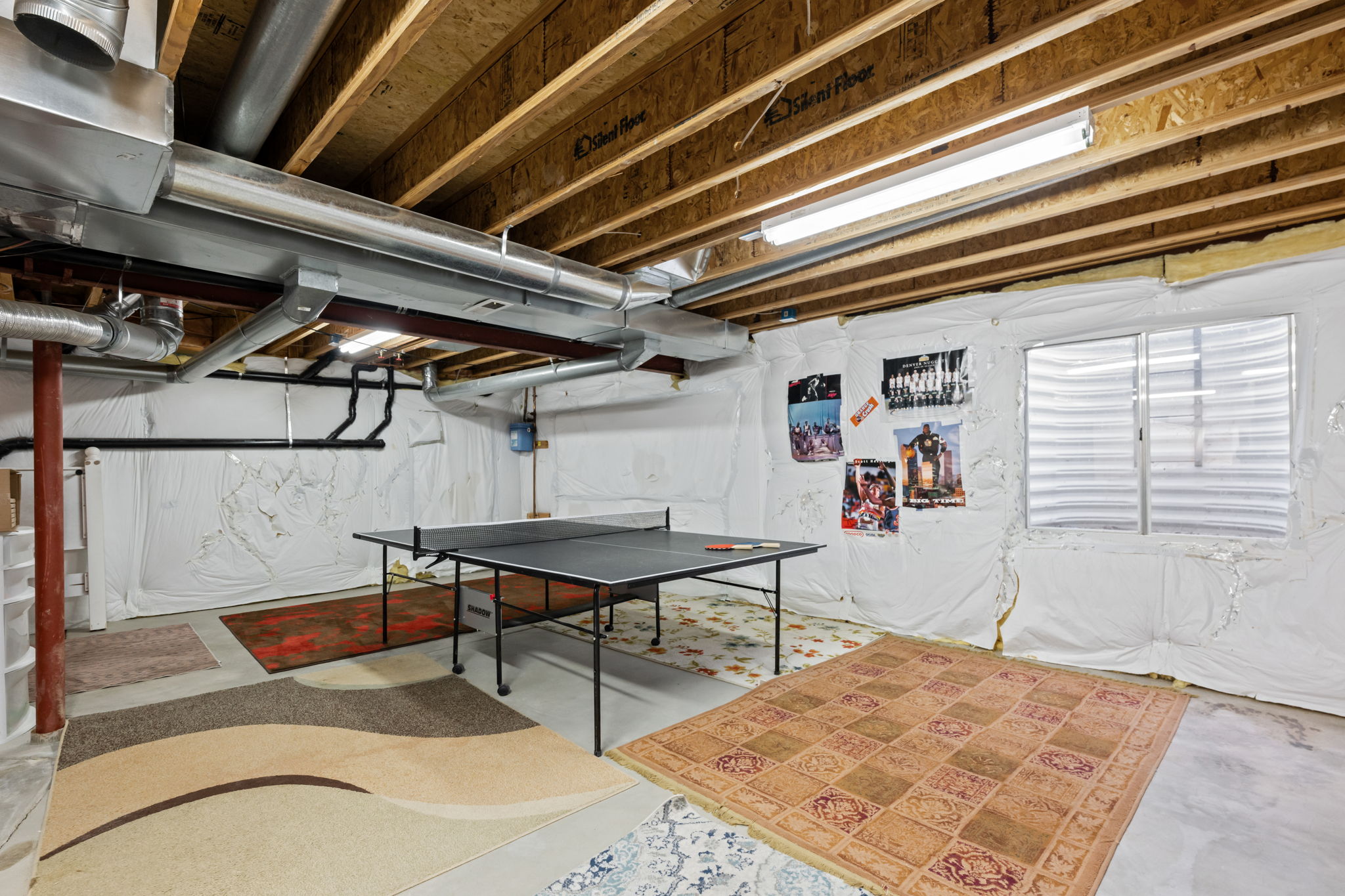 Pingpong table in unfinished basement