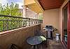 Private patio with a grill and view of the Moab Rim