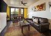 cozy living room with a queen sofa bed and patio access