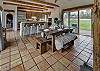 Open kitchen with bar, spacious dining area, perfect for entertaining. 