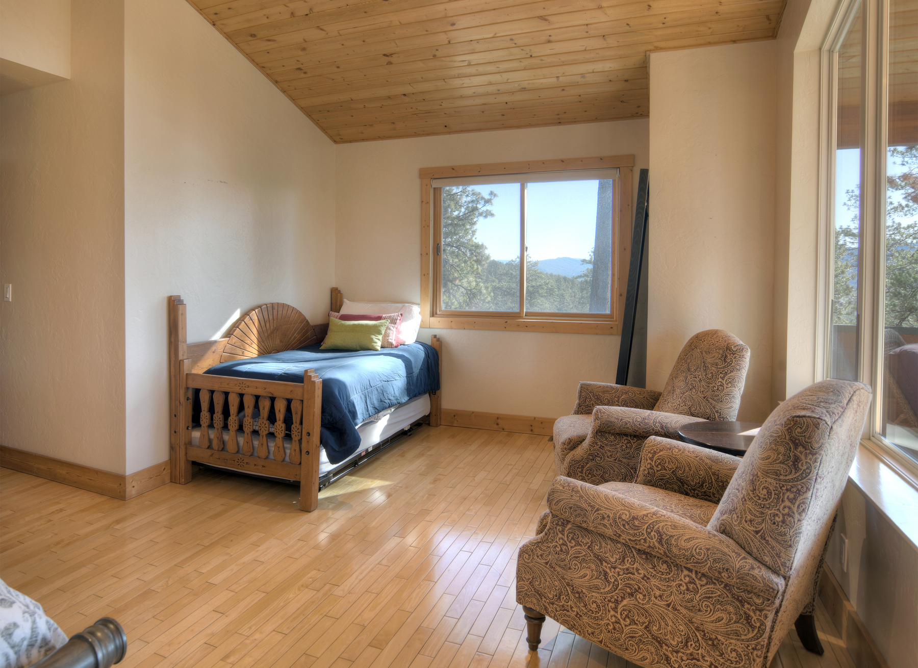 Master bedroom with king bed, ceiling fan, gas fireplace, TV and deck.