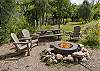 Gas firepit with seating on the Animas River