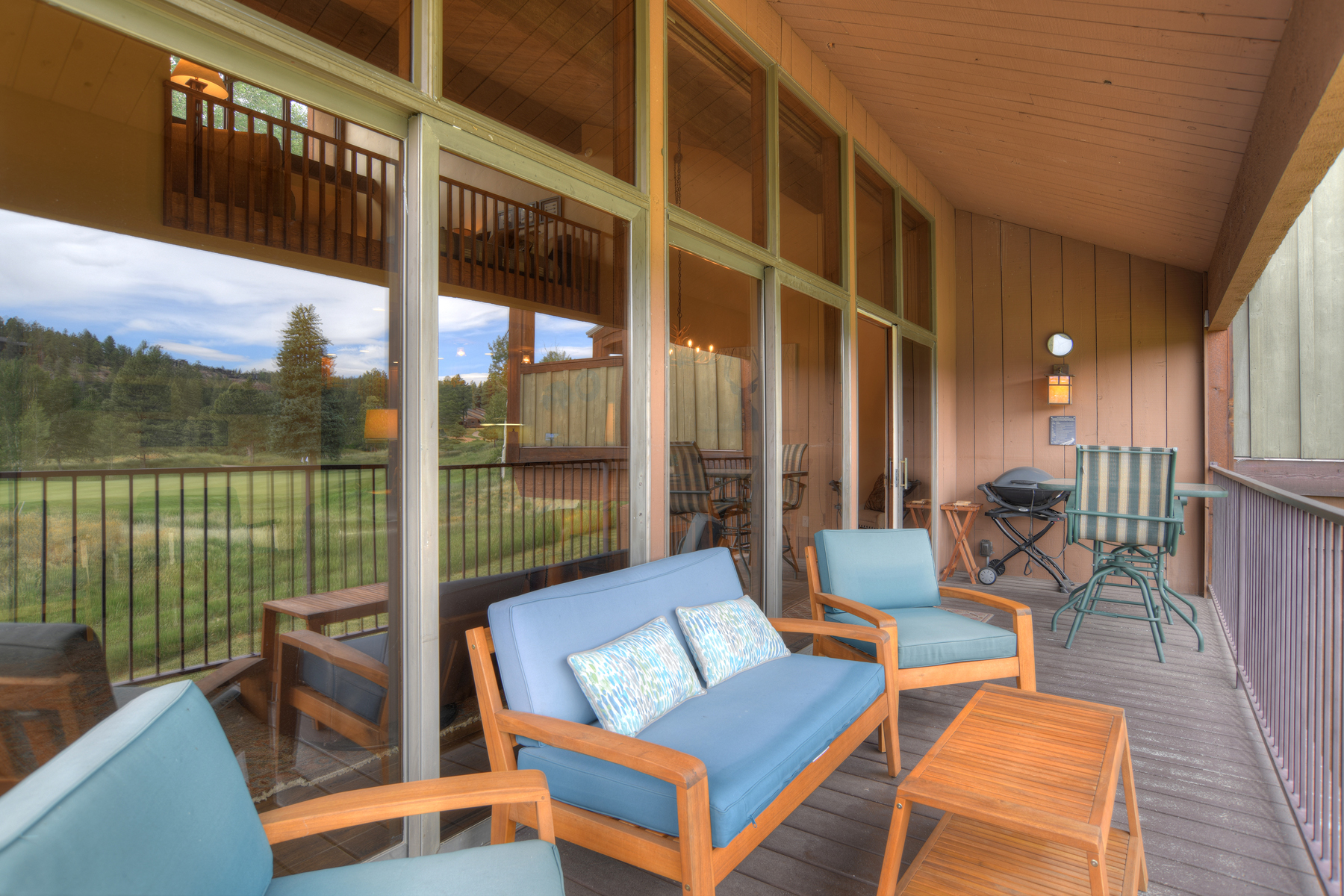 Deck includes outdoor seating and a BBQ grill.