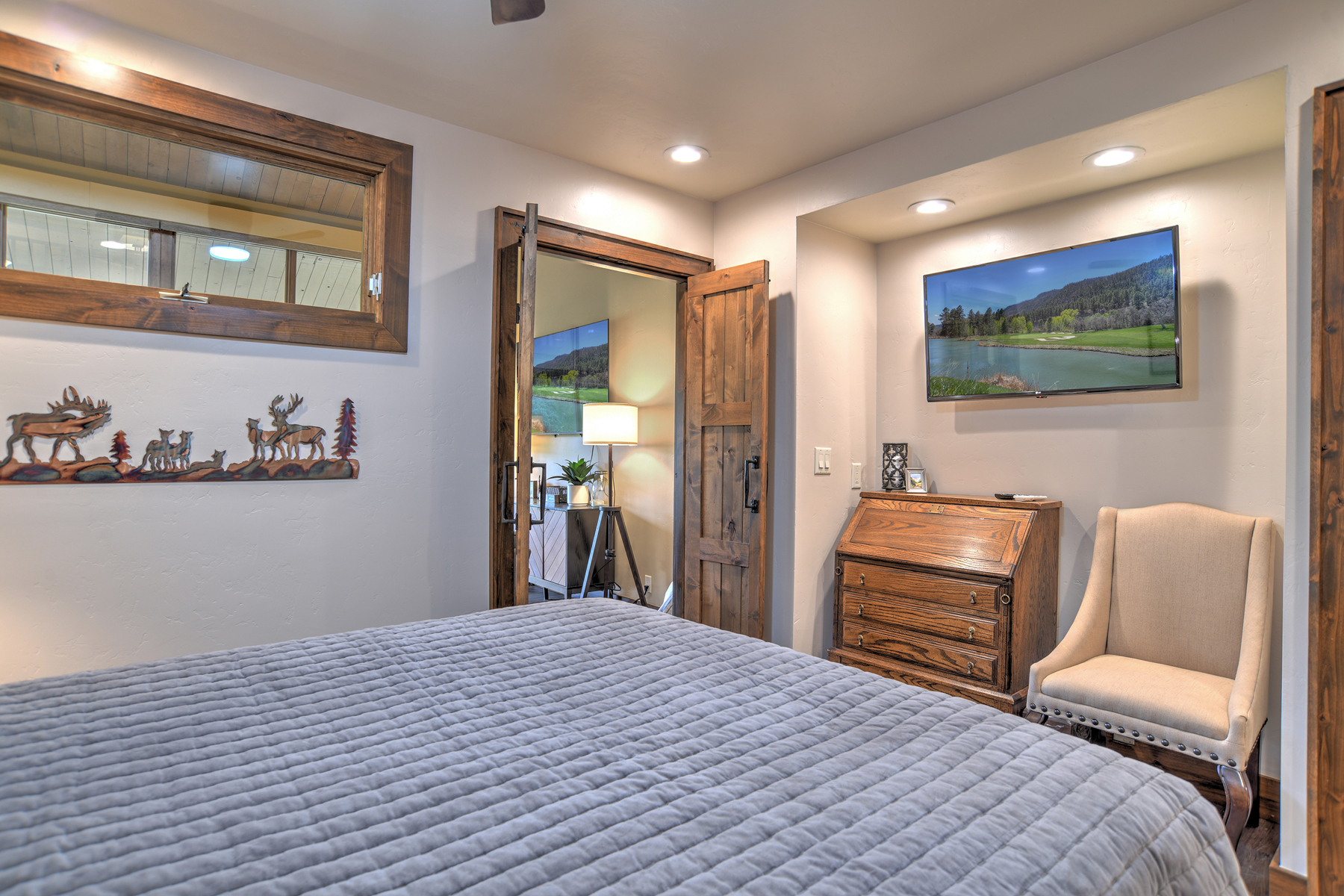 Relax and recharge in this cozy queen bedroom retreat on the main level