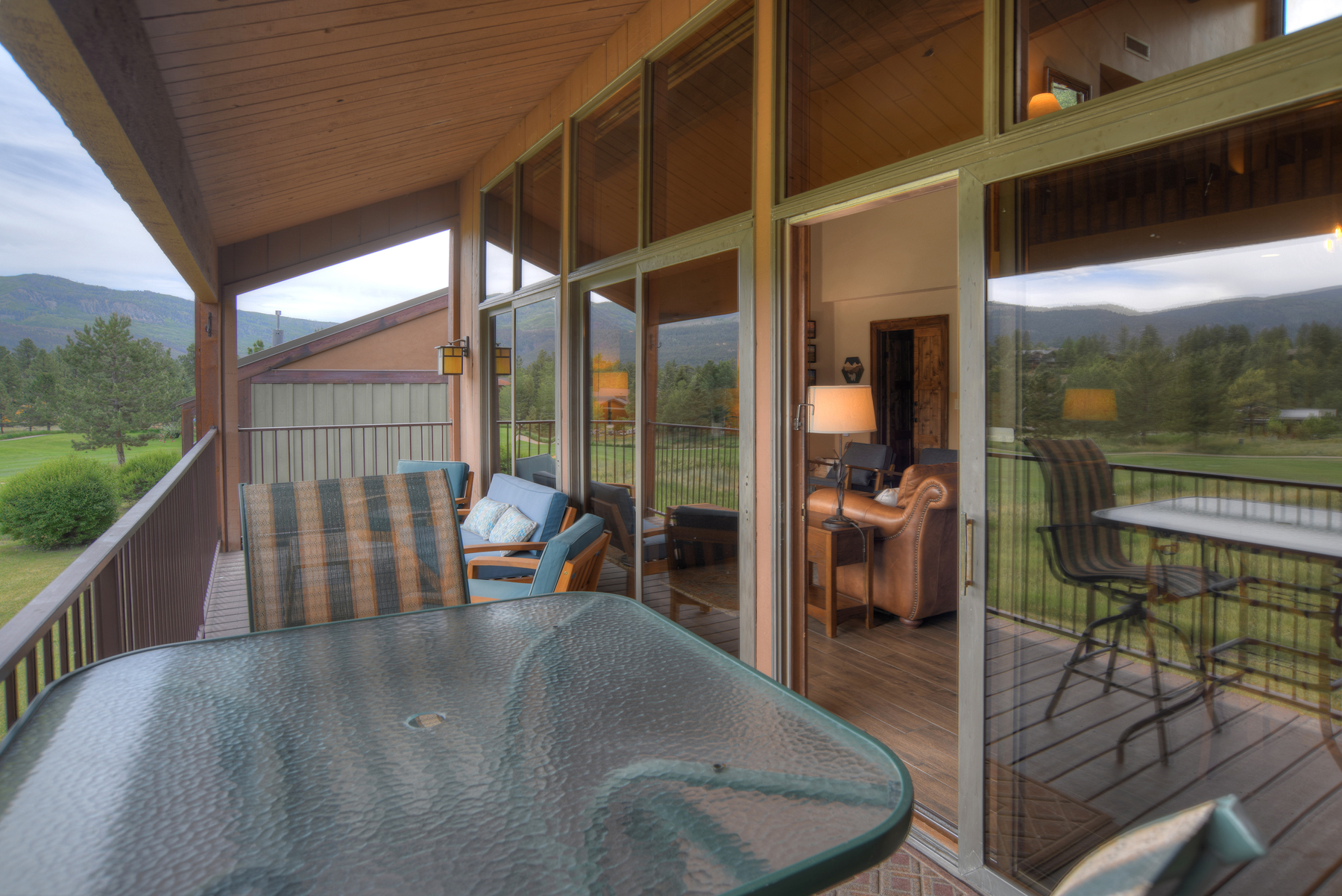 Outdoor dining area on deck with seating for 4. 