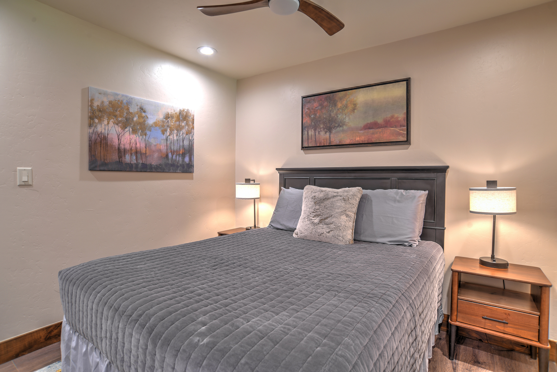 Relax and recharge in this cozy queen bedroom retreat on the main level