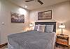 Relax and recharge in this cozy queen bedroom retreat on the main level