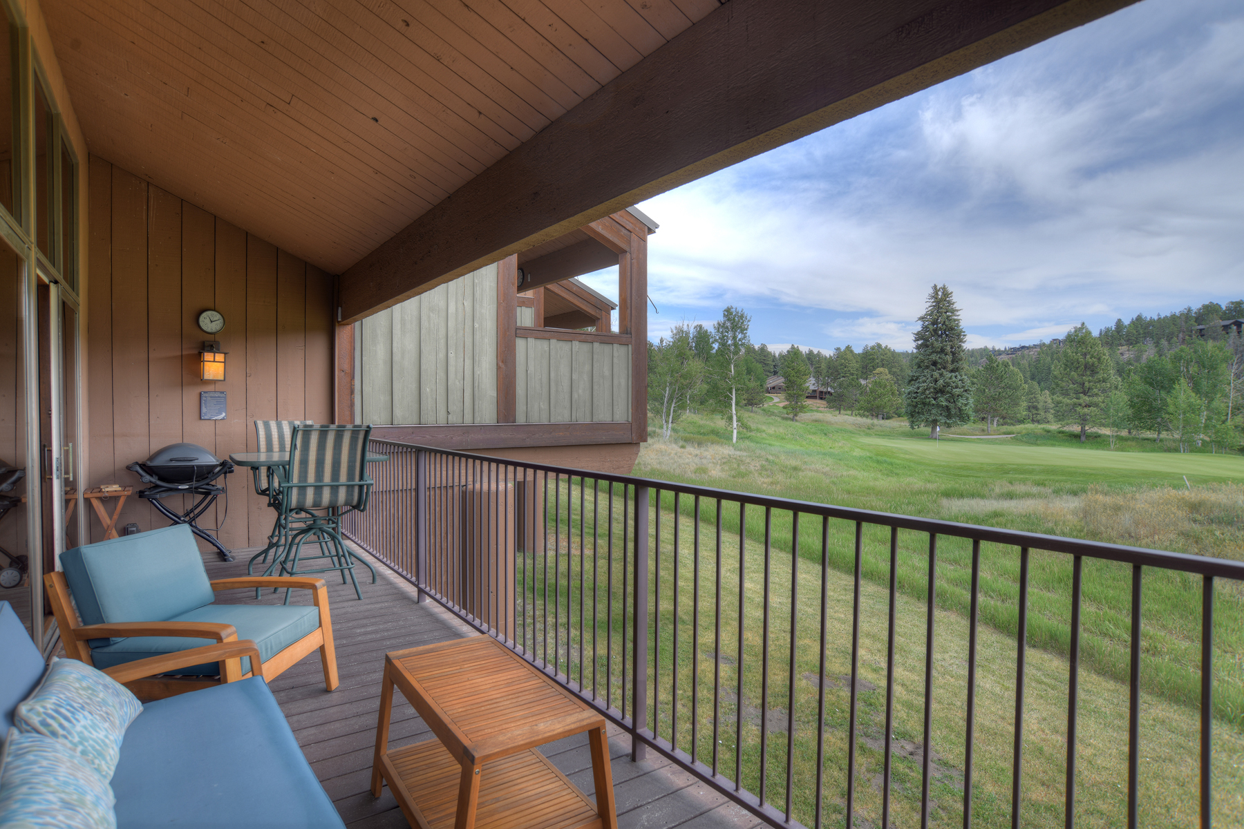 Deck includes outdoor seating and a BBQ grill.