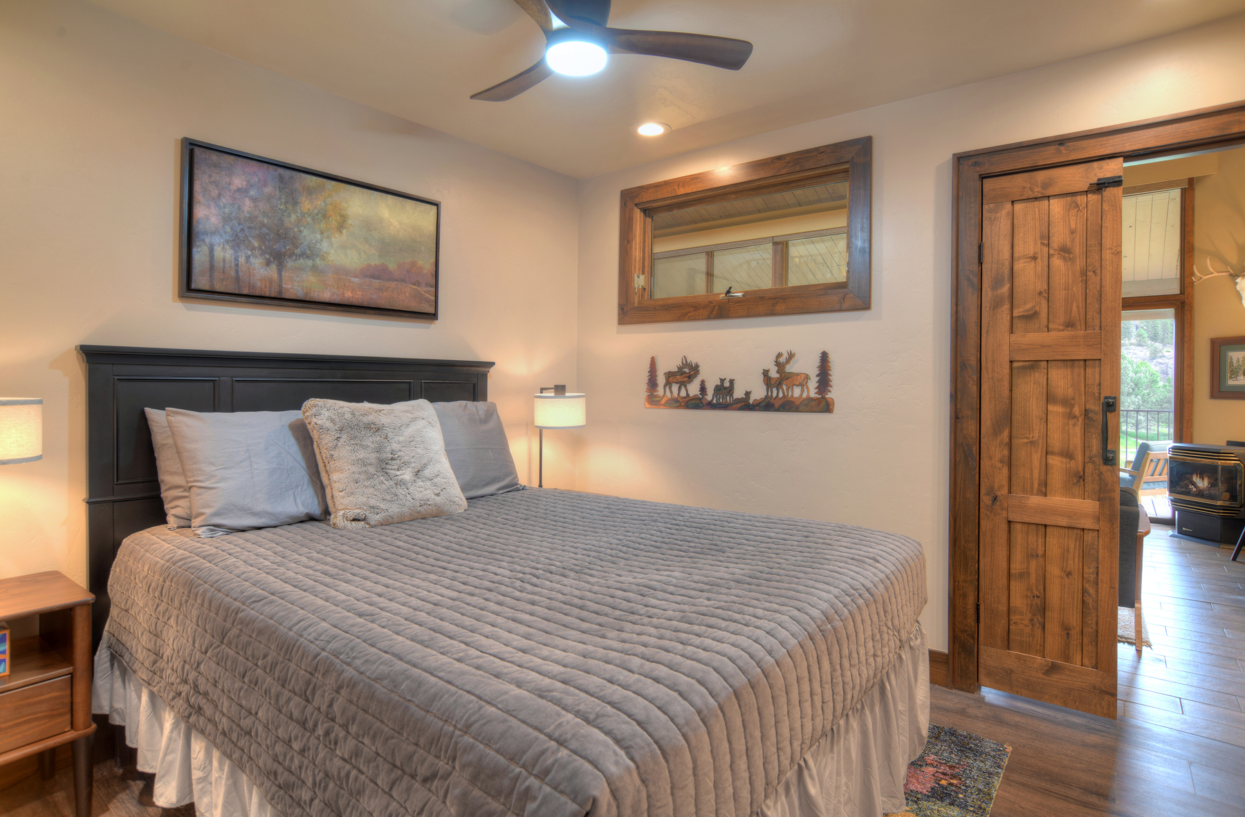 Relax and recharge in this cozy queen bedroom retreat on the main level