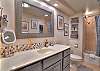 Clean and functional bathroom featuring a tub/shower combination.

