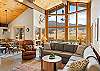 Open living room, dining room, sitting area and kitchen.