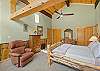 Main Bedroom with King Bed, Ensuite Bathroom and workspace.
