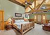 Main Bedroom with King Bed, Ensuite Bathroom and workspace.