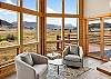 Sitting area with deck access and mountain views.