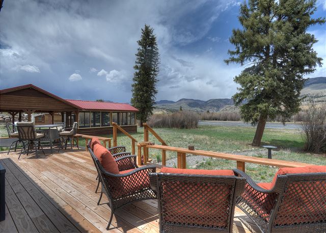 Riverfront Deck with Outdoor Dining and Lounge Chairs