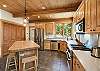 Fully Stocked Kitchen with Kitchen Island and Breakfast Bar