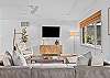 Living Room - Smart TV, Modern Decor, Ceiling Fan, and Natural Lighting 