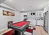 Game Space with Pool Table and Kitchen in Basement