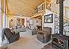 Living room with woodburning stove, smart TV and open concept. 
