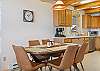 Open kitchen, dining, and living room.