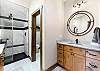 The Main bedroom ensuite bathroom has dual sinks, a walk-in shower, and a separate water closet. 