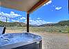 Private 6 person hot tub with stunning mountain views.