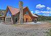 Outdoor living space with unmatched mountain views.  The circular drive around the house allows for easy parking.