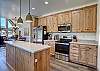 Our fully equipped kitchen with custom built Amish cabinets and electric range.