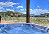 Private 6 person hot tub with stunning mountain views.