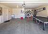 garage with ping pong table and gas heater that you can roll onto the patio. Please note the bikes pictured are owner's bikes and are not available for guest use. 