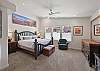 Master bedroom with king bed and attached bath