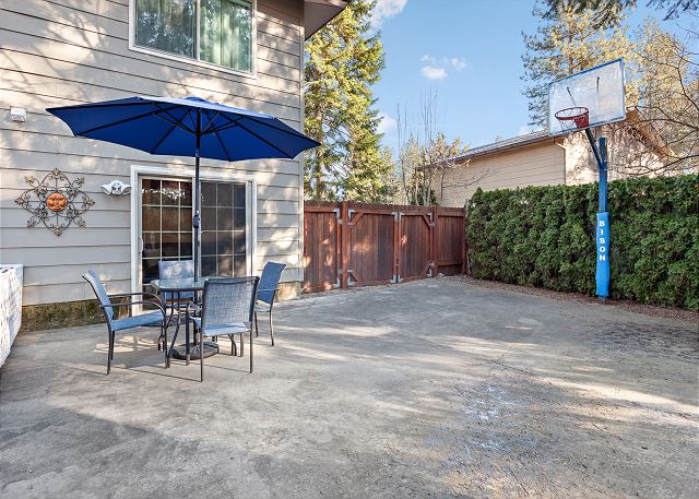 Basketball and Outdoor Dining Table with Umbrella and Seating for Four (4), Fenced Yard.