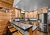 Additional Kitchen bar top dining.  Oversized refrigerator to hold all your supplies.  Extra refrigerator in the garage (not pictured).