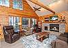 Living Room with fireplace and wall of windows.