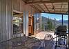 Covered Deck with Outdoor Seating and Grill