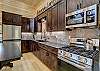 Fully Equipped kitchen with stainless steel appliances, gas range, and lots of counter space.  