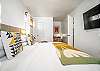 King bedroom with desk and smart TV