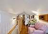 Second floor bedroom with two twin beds and ensuite bathroom with deck. 
