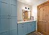 Main floor bathroom with shower/tub combo and washer/dryer.