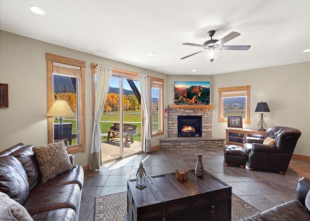 Our open living room with Smart TV, gas fireplace, which overlooks the third (3rd) tee box of the prestigious Rio Grande Golf Course.