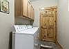 Private/onsite laundry room with washer and dryer.