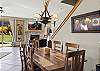 Dining area off open kitchen and living room with views of third (3rd) tee box.