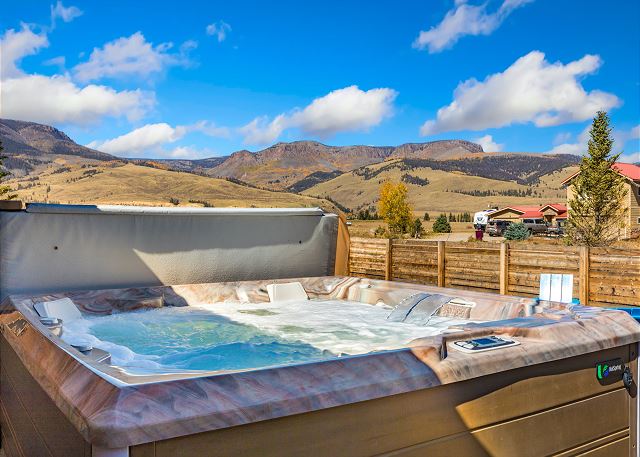 Private hot tub with mountain views.